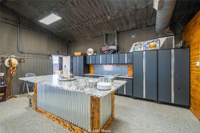 kitchen featuring wooden walls