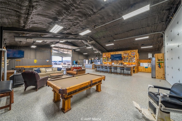 playroom featuring lofted ceiling, pool table, and bar area