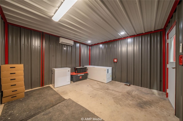 basement with fridge and a wall mounted air conditioner