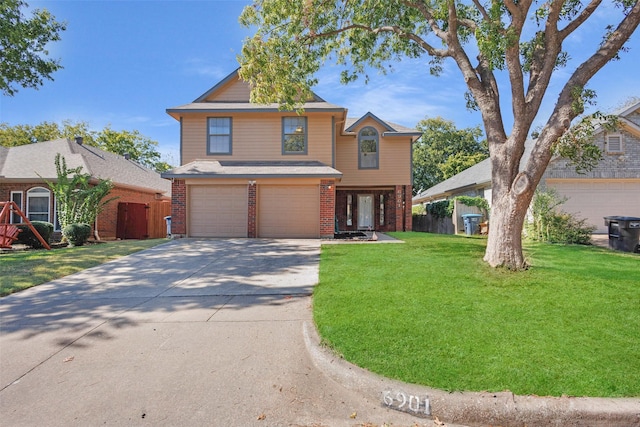 front facade featuring a front lawn and a garage