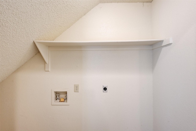 laundry area with hookup for a washing machine, electric dryer hookup, and a textured ceiling