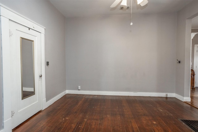 unfurnished room featuring ceiling fan and dark hardwood / wood-style flooring