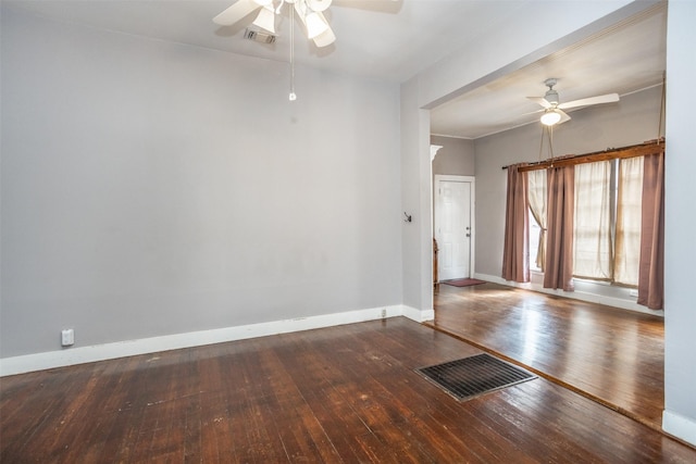 empty room featuring hardwood / wood-style floors and ceiling fan