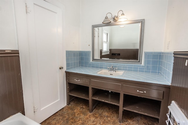 bathroom with vanity and decorative backsplash