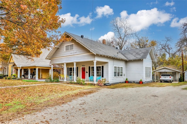 view of front of property with a porch and a garage