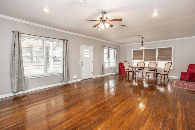 interior space featuring dark hardwood / wood-style flooring, ornamental molding, and ceiling fan