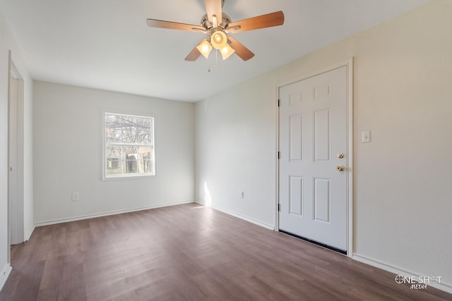 unfurnished room with hardwood / wood-style floors and ceiling fan