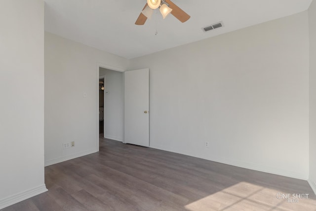 spare room with hardwood / wood-style flooring and ceiling fan