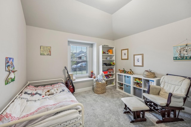 carpeted bedroom featuring lofted ceiling