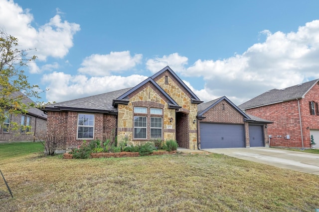 view of front of property featuring a front yard and a garage