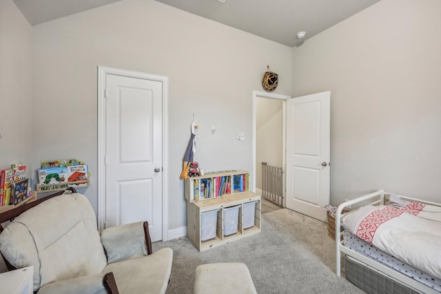 bedroom with light carpet and vaulted ceiling