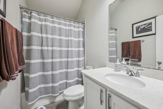 full bathroom featuring shower / tub combo with curtain, vanity, toilet, and vaulted ceiling