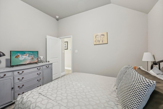 bedroom featuring lofted ceiling