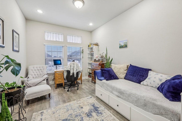 home office with light hardwood / wood-style floors