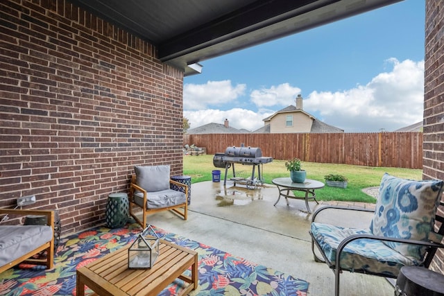 view of patio / terrace with grilling area and an outdoor hangout area