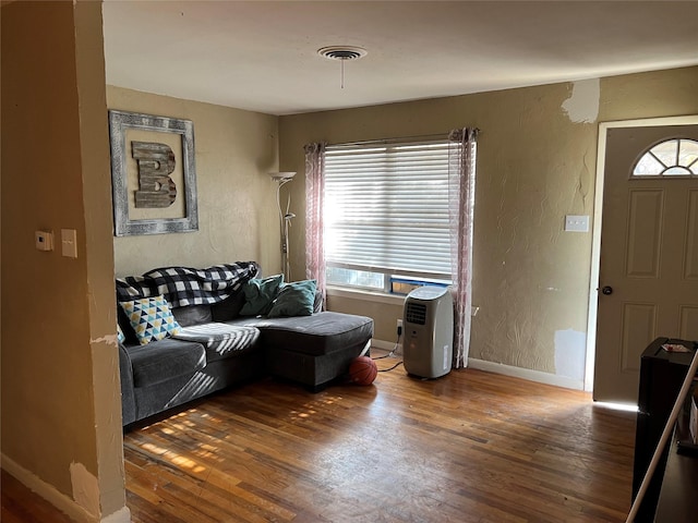 living room featuring dark hardwood / wood-style flooring