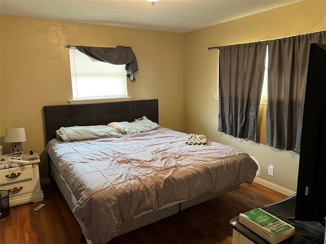 bedroom featuring dark wood-type flooring