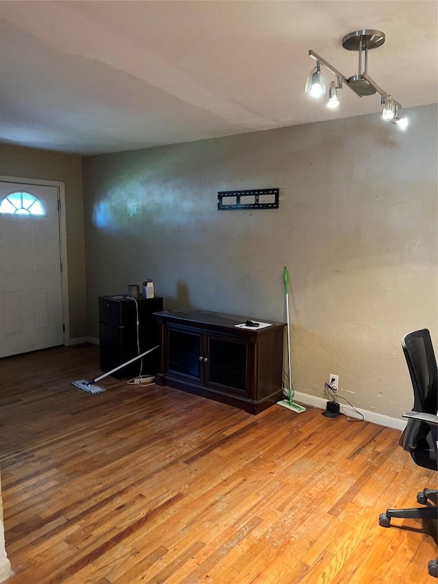 1019 W Bullock St, Denison, TX 75020 - office area featuring track lighting, light wood-style flooring, and baseboards