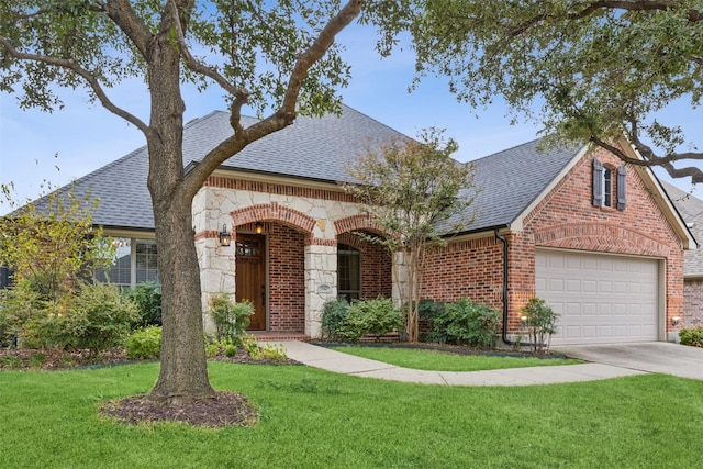 view of front of property featuring a front yard and a garage