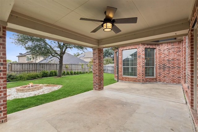 view of patio / terrace featuring ceiling fan and an outdoor fire pit