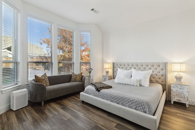 bedroom with dark wood-type flooring