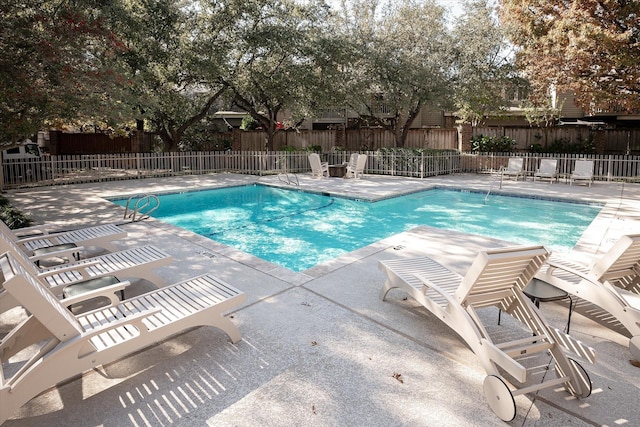 view of swimming pool with a patio