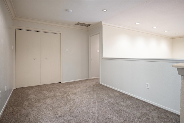 unfurnished bedroom featuring carpet flooring and crown molding