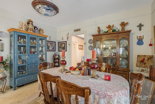 view of carpeted dining area