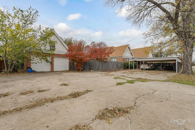 exterior space featuring a carport and a garage