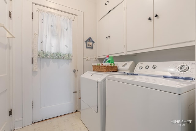 washroom with cabinets and independent washer and dryer