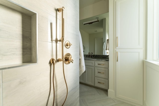 bathroom with vanity and parquet floors