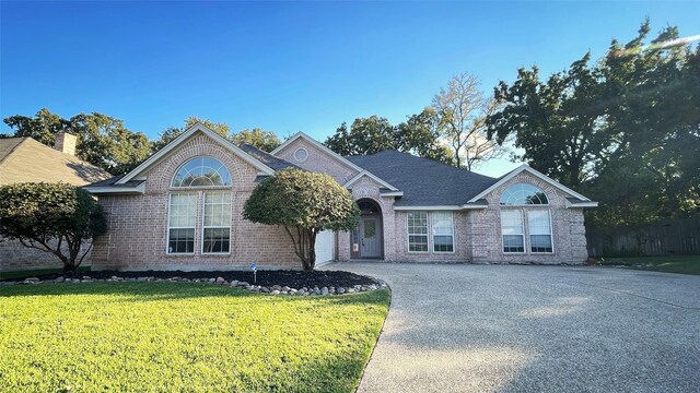 view of front of property with a front lawn