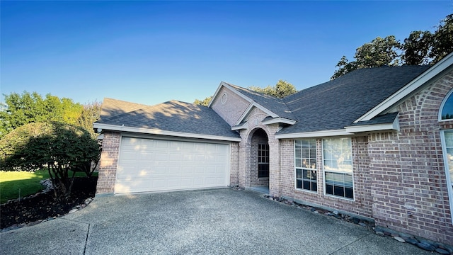 ranch-style house featuring a garage