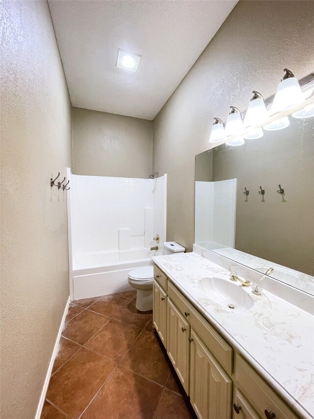 full bathroom with tile patterned floors, vanity, a textured ceiling, shower / tub combination, and toilet