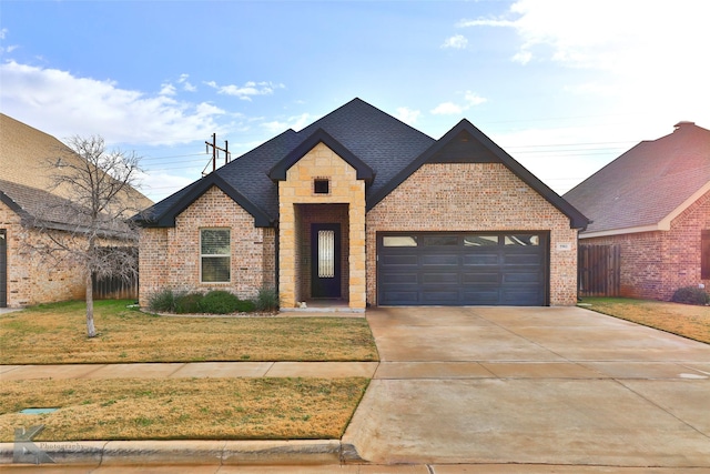 view of front facade with a front yard and a garage