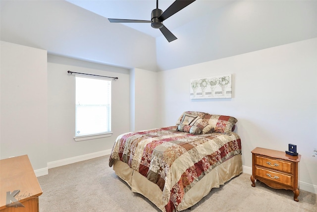 bedroom with ceiling fan, light carpet, and vaulted ceiling