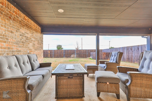 view of patio / terrace featuring an outdoor living space with a fire pit