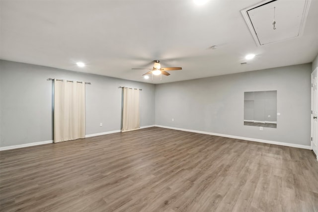 empty room featuring wood-type flooring and ceiling fan