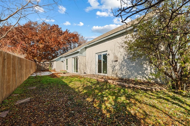 view of property exterior featuring a lawn