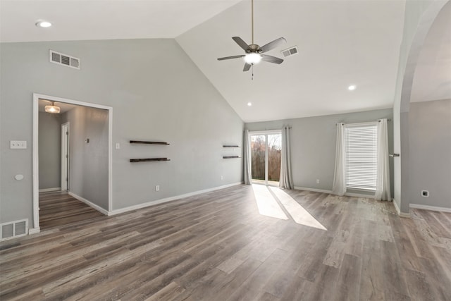 unfurnished living room featuring hardwood / wood-style flooring, high vaulted ceiling, and ceiling fan