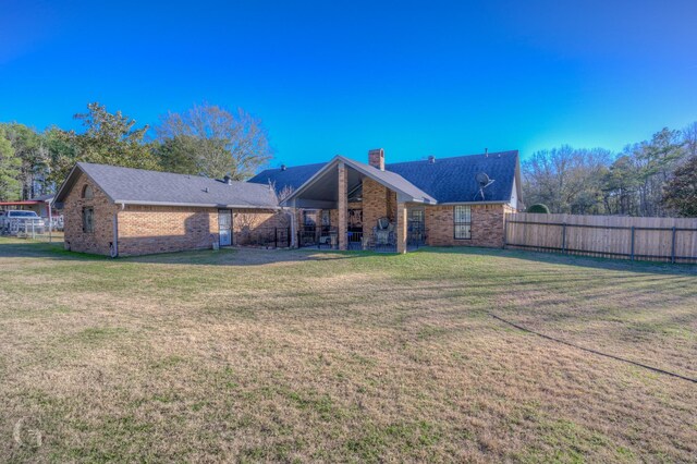 111 White Rd, Frierson, LA 71027 - back of house featuring a yard