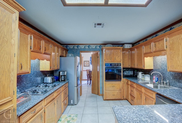 111 White Rd, Frierson, LA 71027 - kitchen with sink, light tile patterned floors, black appliances, and backsplash