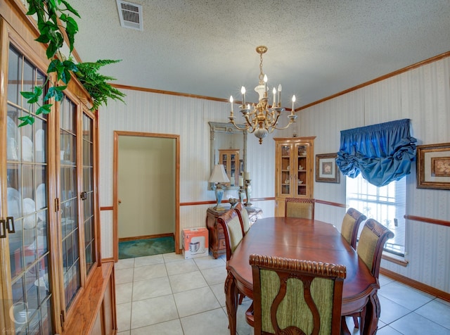 111 White Rd, Frierson, LA 71027 - dining area with an inviting chandelier, ornamental molding, a textured ceiling, and light tile patterned floors
