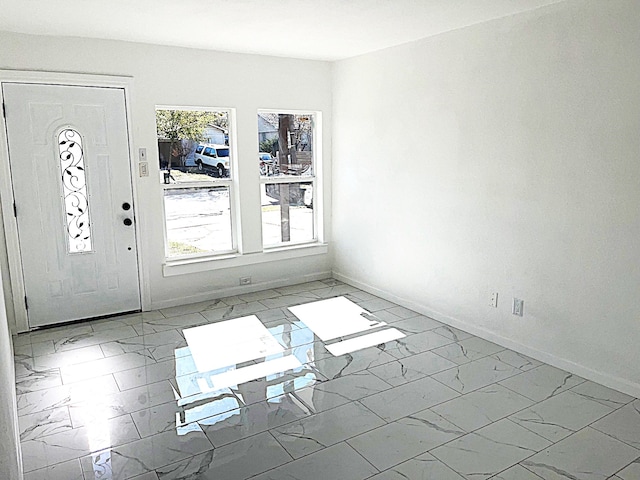 foyer entrance featuring a wealth of natural light