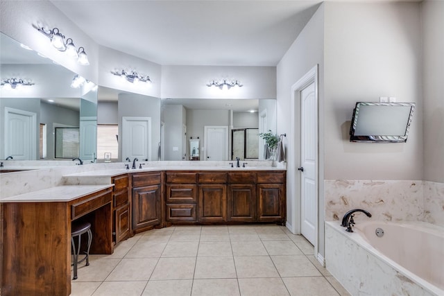 bathroom featuring tile patterned flooring, vanity, and separate shower and tub