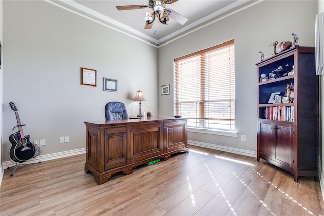 office space with light wood-type flooring, ceiling fan, and ornamental molding