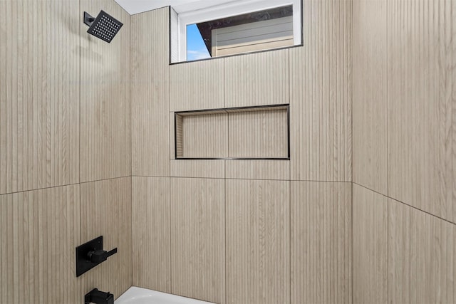 bathroom featuring  shower combination