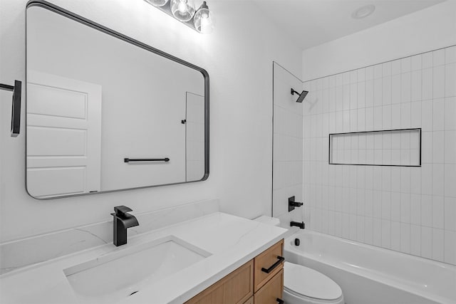 full bathroom with vanity, toilet, and tiled shower / bath combo