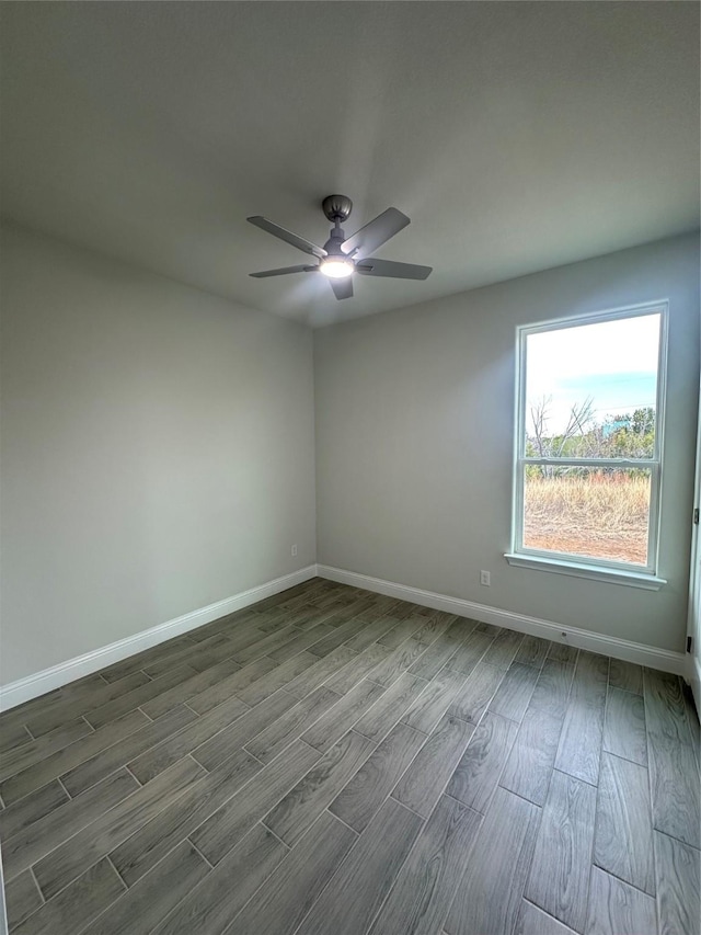 unfurnished room featuring hardwood / wood-style floors and ceiling fan