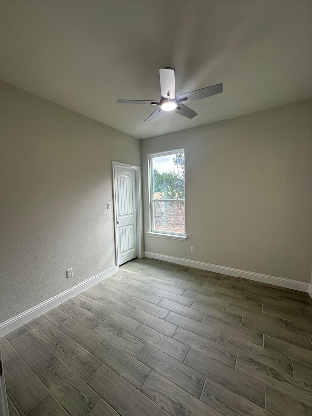 unfurnished room with ceiling fan